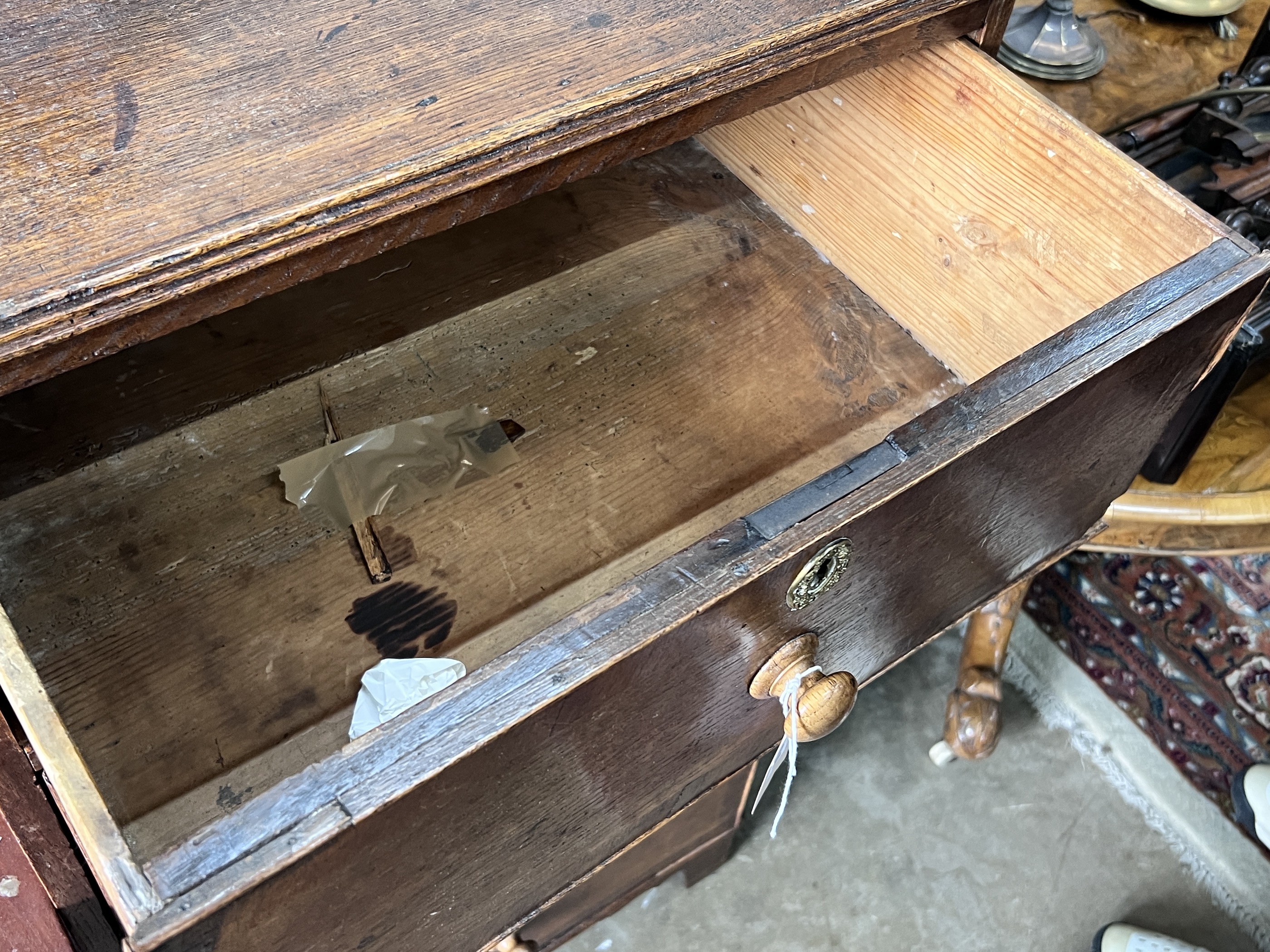 An early 19th century narrow oak four drawer chest, width 59cm, depth 48cm, height 106cm